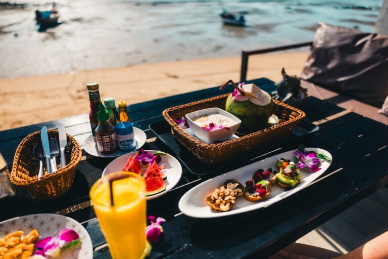 Experience exotic dining by the beach in Phuket with fresh tropical fruits and drinks.